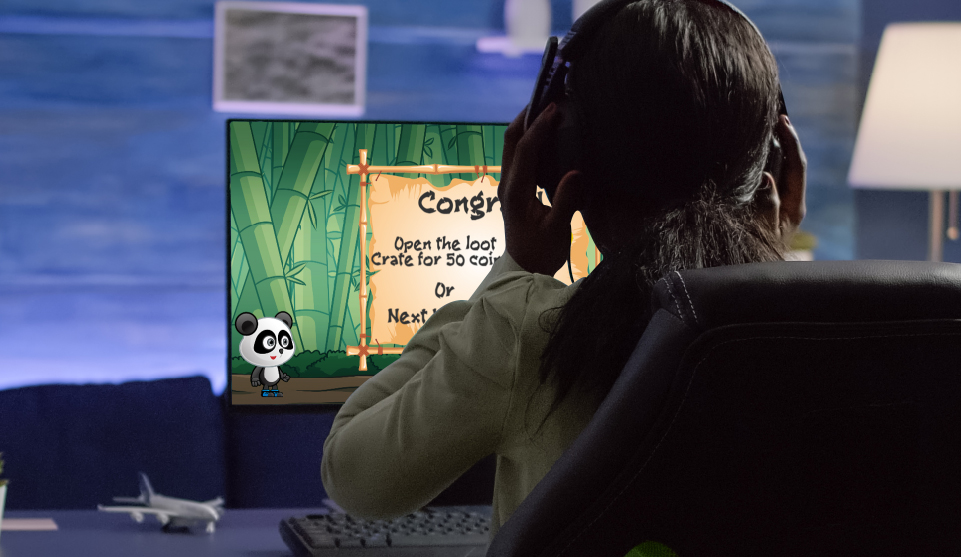 Child playing game in front of a monitor